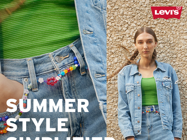 women model wearing levi''s clothing in front of stone wall